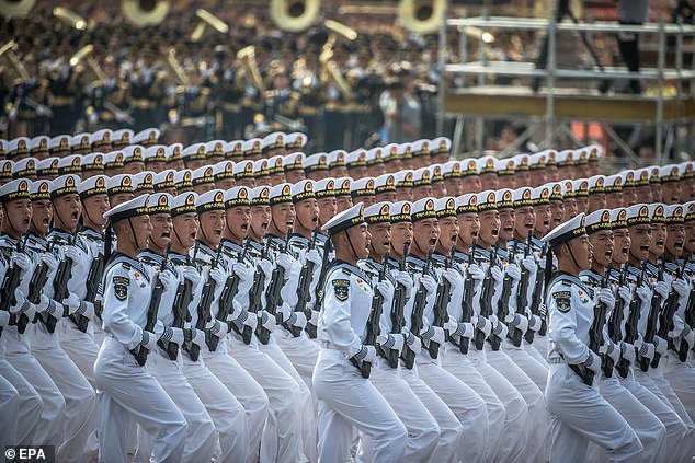 Chinese naval troops march past Tiananmen Square during a military parade