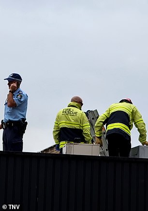 Firefighters inspect the air conditioner