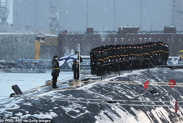 Image shows the new Russian nuclear submarine during a flag-raising ceremony led by Vladimir Putin in the Arctic port of Severodvinsk on December 11, 2023