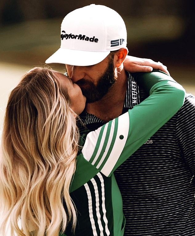 Johnson kisses his wife Paulina – daughter of NHL legend Wayne Gretzky – after a round