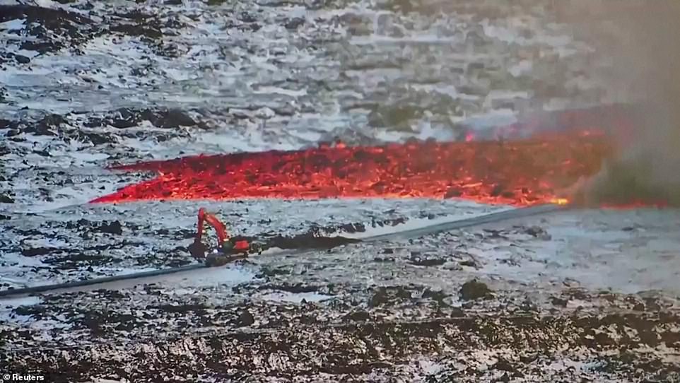 Eventually, a car that was in the lava's path and the work crew quickly flee, followed by clouds of black thick smoke billowing from the lava.