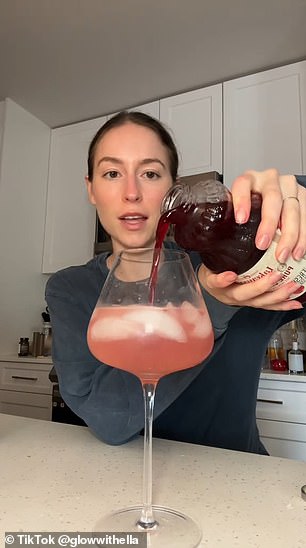 The health expert then rounded out the drink with sparkling water, a slice of orange as a decorative garnish and a few drops of digestive bitters.