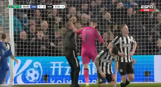 Dubravka tried to push the invader away after he ran towards the goalkeeper