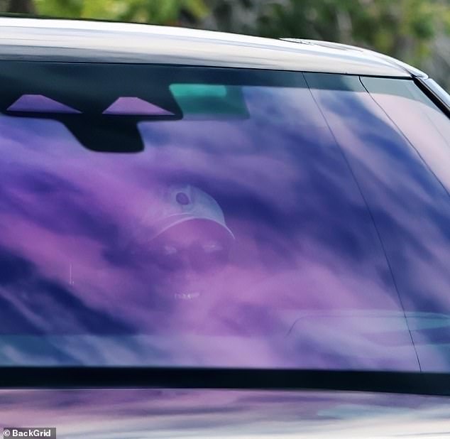 Meghan was all smiles as she drove around the couple's $14.65 million Montecito home on Wednesday