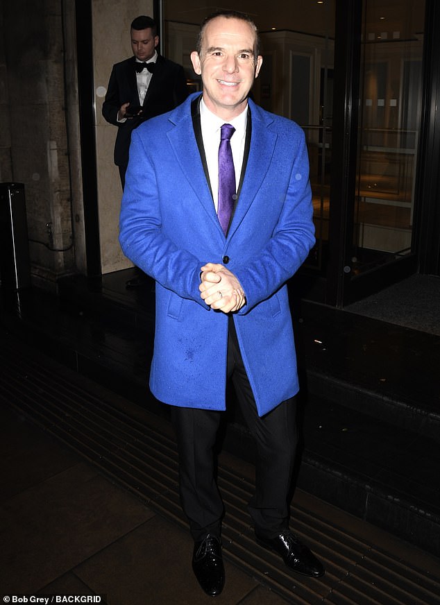 Martin, 51, famous for his eponymous Money Show, wore a bright blue jacket with a black suit and purple tie and shiny black shoes