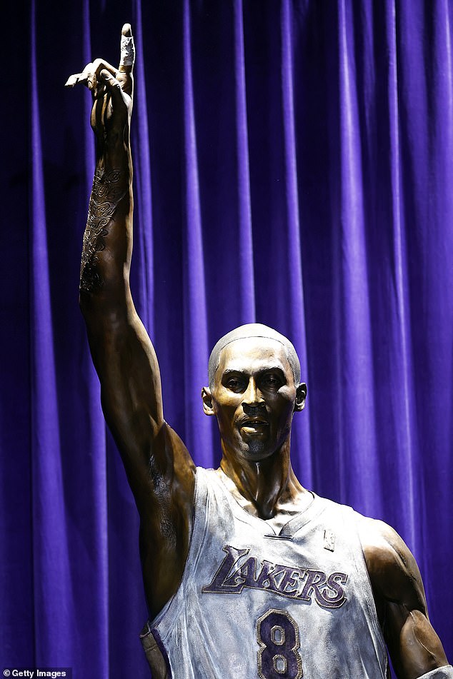 The 4,000-pound statue shows Bryant in his white No. 8 jersey with his index finger raised