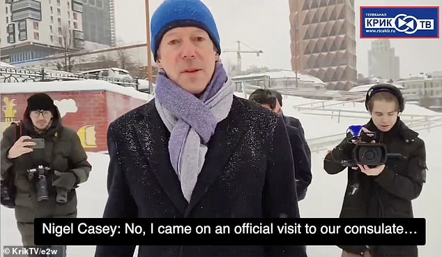 Casey explained to the man who confronted him that he was in the Urals visiting the British Consulate while men with cameras filmed the interaction.