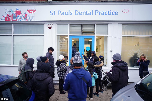 The police were even forced to turn away some patients.  Pictured, patients outside St Pauls dental surgery on Wednesday