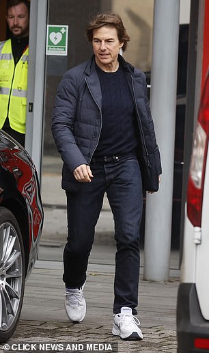 The Hollywood star opted for smart casual in a navy blue sweater with a padded jacket, which he paired with jeans and white sneakers