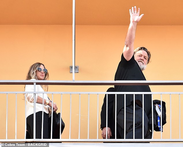 The actor, 59, appeared in good spirits as he waved to fans