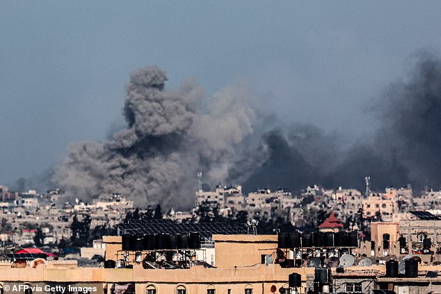 A photo taken from Rafah shows clouds of smoke during the Israeli bombardment of Khan Yunis in the southern Gaza Strip on Friday