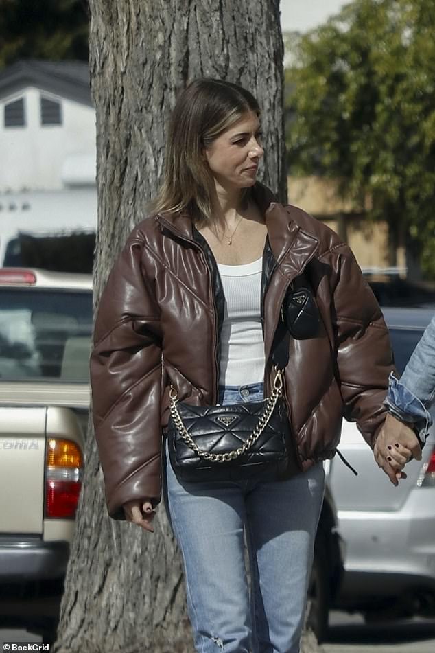 Rizzo looked admiringly at her husband as they walked from the parking lot to lunch