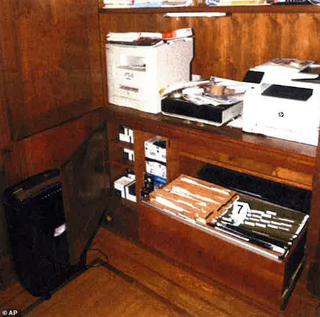 This image, included in Special Counsel Robert Hur's report, shows notebooks in a filing cabinet under a printer that were seized from President Joe Biden's home office in Wilmington, Del., on Jan. 20, 2023.  search by FBI agents