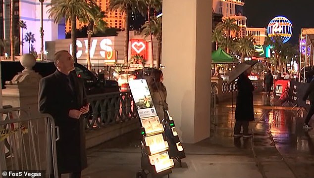 Michael Federico and his wife Tanya stood on the iconic Strip next to illuminated magazine racks full of pamphlets with information about the 'denomination'