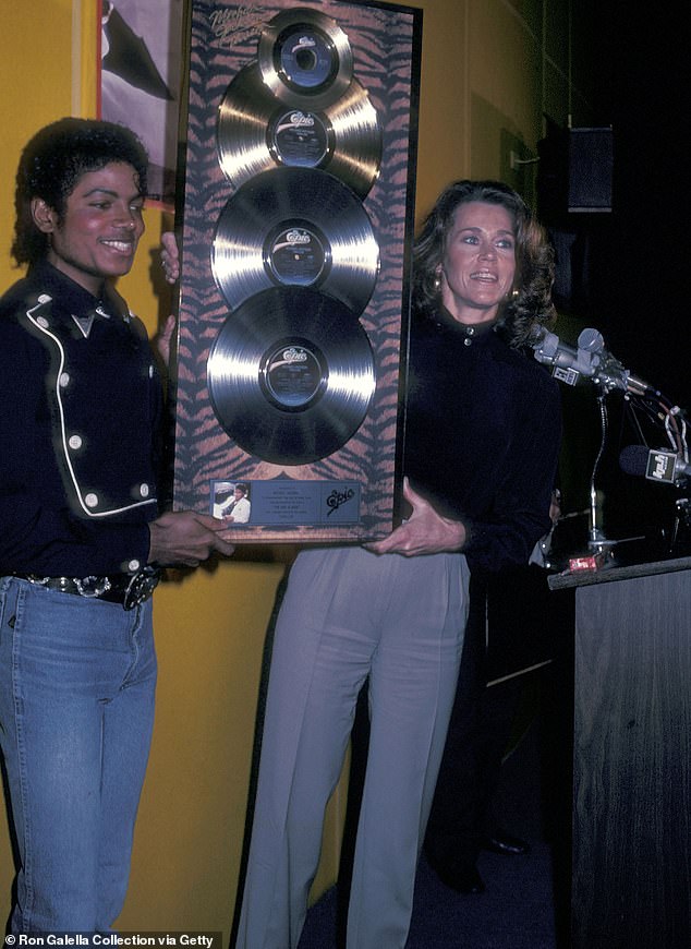 Thriller reached the milestone of being the first album to reach 30 times platinum;  pictured with Jane Fonda in 1982