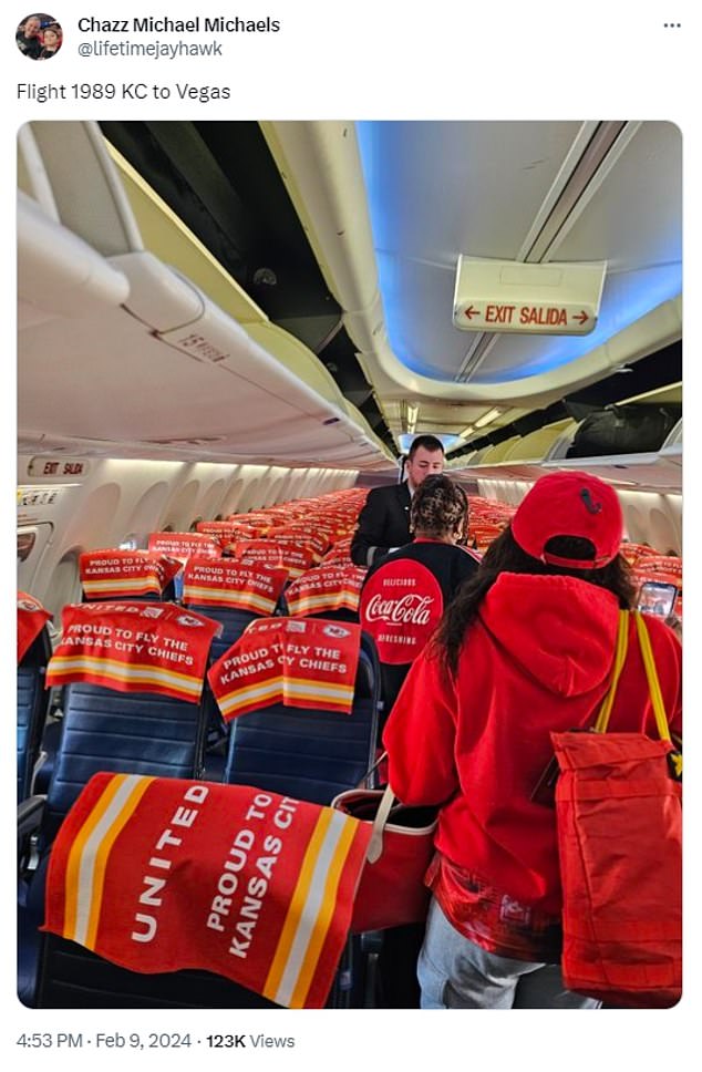 Red and yellow flags draped over the backs of the seats reading 'proud to drive the Kansas City Chiefs'