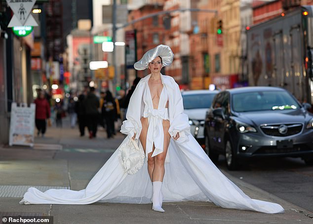 Julia opted for a low-cut white bow-style bodysuit that showed off her hips, her midriff and her chest