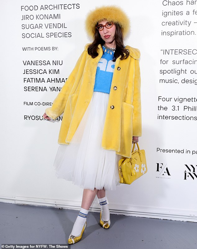 Caroline Vazzana opted for a yellow button-up coat, paired with a matching hat, bag and shoes, and she added some extra color to her look with a bright blue shirt