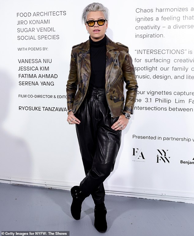 Victoria Brito wore a motorcycle jacket with camouflage print and a black turtleneck during the presentation