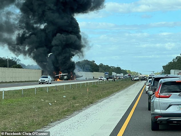 At least one brave motorist was seen rushing to the crashed plane, hoping to help the survivors despite the extreme danger