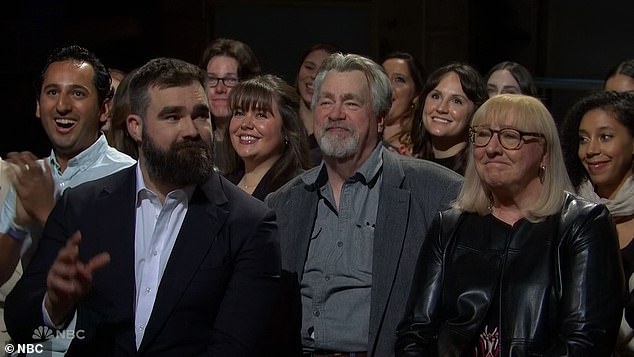 Jason was pictured with his parents in the audience while Travis took on the role of host