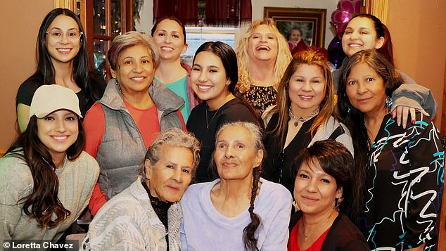 The long-lost twins pose with some of their extended family, many of whom met for the first time that day