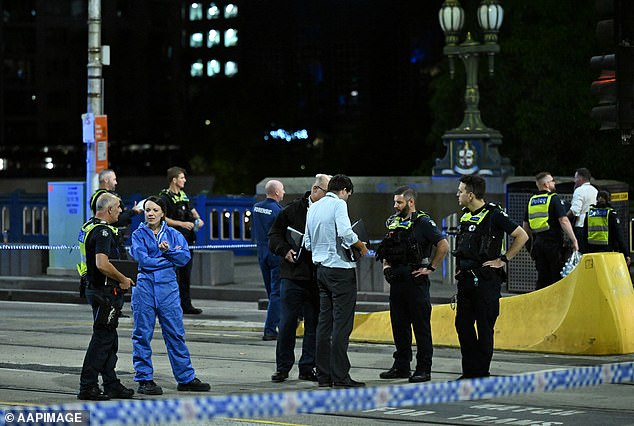 Two separate incidents converged around Princes Bridge near Flinders Street Station, with officers and emergency services remaining at the scene well into the night (pictured)