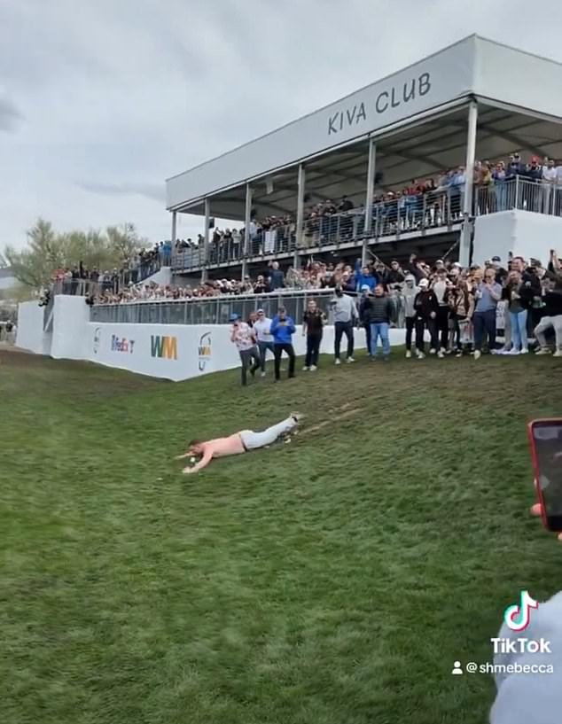 Even more fans enjoyed themselves by sliding down a muddy hill before it was closed off by police