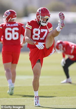 Travis Kelce is stretching on Friday