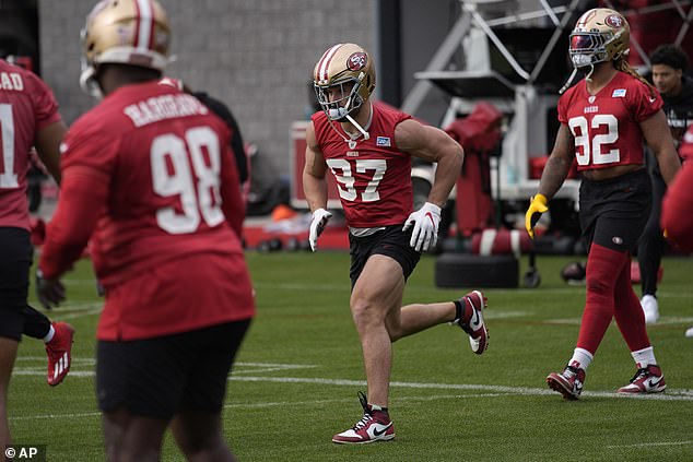 49ers defensive end Nick Bosa walks with his teammates prior to the showdown