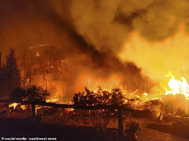 A fire rages after a Russian drone strike hit a former leisure center and hotel in Zmiiv, Kharkov