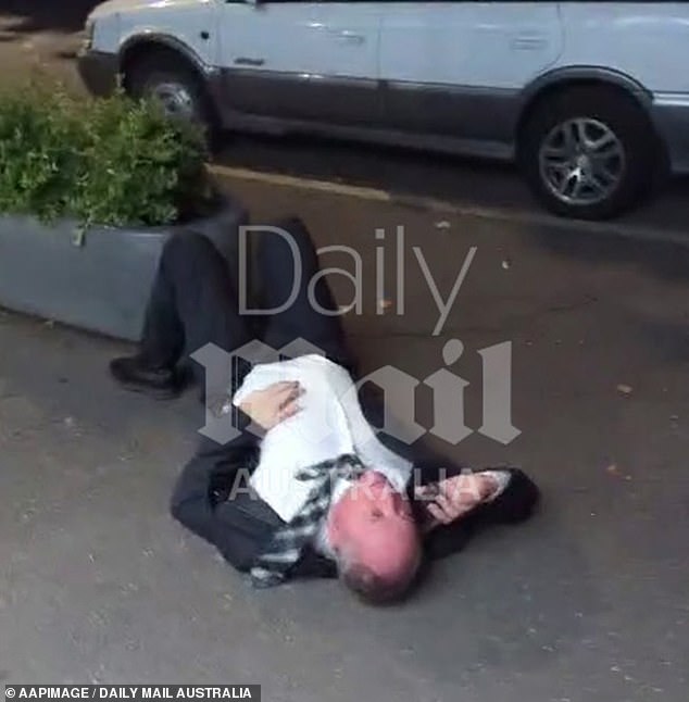 Daily Mail Australia unveiled an exclusive video of the country's former Deputy Prime Minister lying on the sidewalk (pictured) in Canberra on Wednesday evening