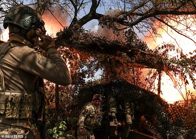 Ukrainian soldiers fire a D-20 howitzer at Russian troops at a position near the frontline city of Bakhmut.  Sholz is in town to bolster support for a new U.S. aid package for Ukraine