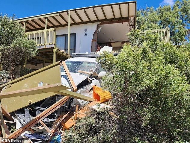 The driver's costly mistake left a trail of destruction, with rocks and debris from the house (pictured) strewn everywhere