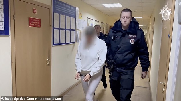 Agafonova is escorted by officers.  Her pursuit shows the new morality in Russia under Putin amid the war with Ukraine