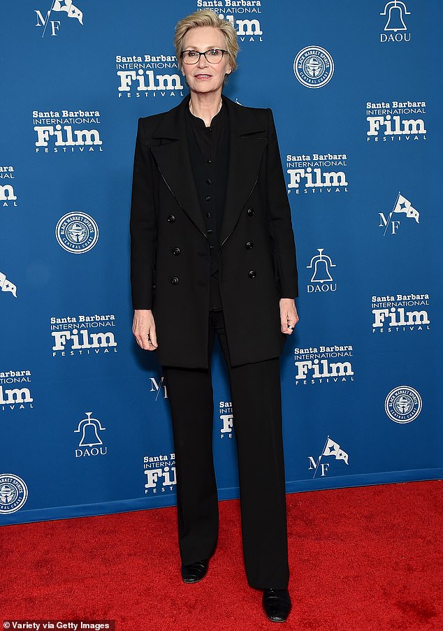 Jane Lynch kept it classy as she wore an all-black outfit that consisted of a double-breasted jacket, fitted trousers and a button-up shirt