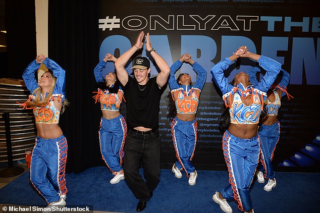 Media personality Noah Beck wore a plain black shirt and black pants as he showed off some of his dancing skills with the Knicks City Dancers