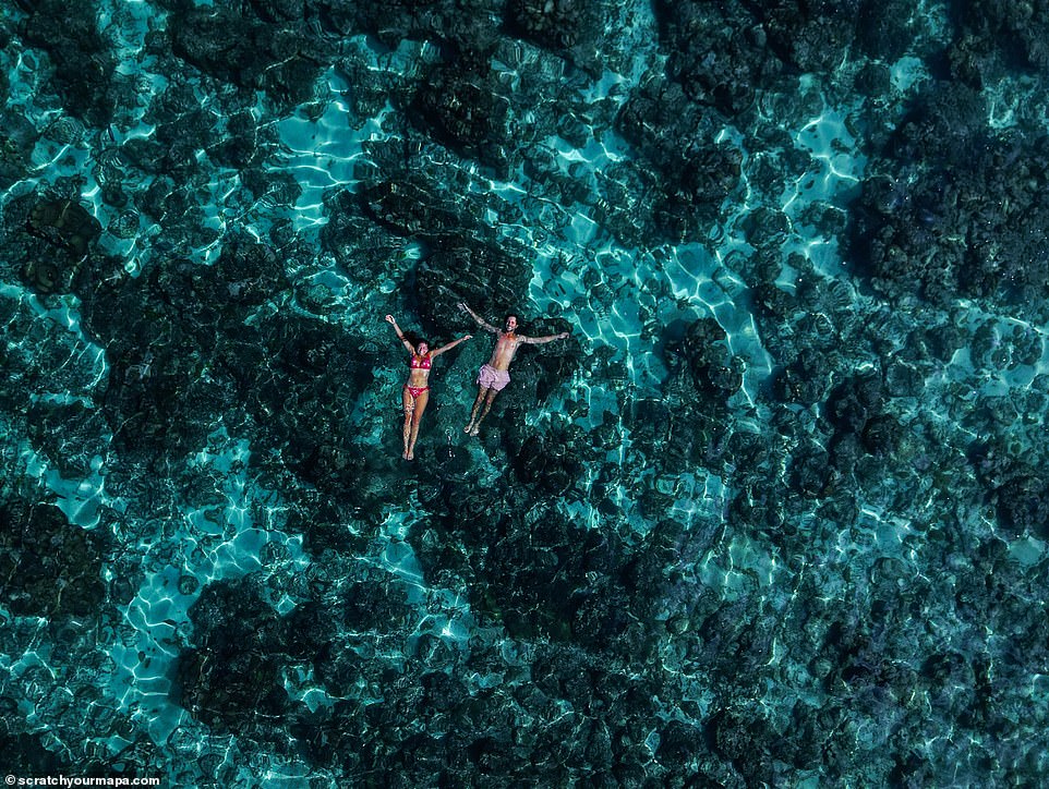 The pair use a variety of photography equipment, including drones, to capture their impressive images.  This aerial photo shows the two relaxing in the waters of Socotra, an island of the Republic of Yemen in the Indian Ocean