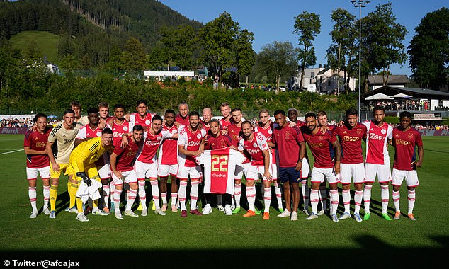 Haller's former Ajax teammates held up a shirt to show their support after his diagnosis