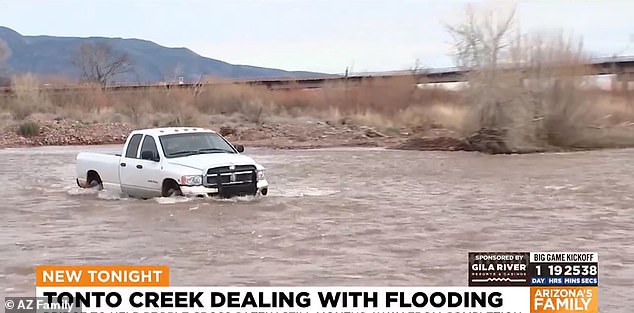 A white pickup truck was spotted stuck in water near Tonto Creek in Arizona on Friday.  The excess water left many motorists stranded on nearby roads