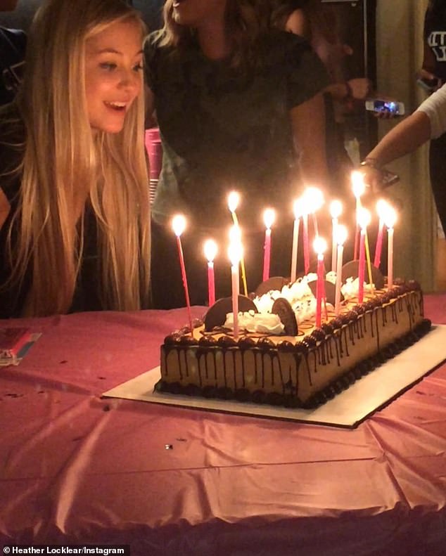 There was an image of Ava blowing out the pink and red candles on her chocolate birthday cake