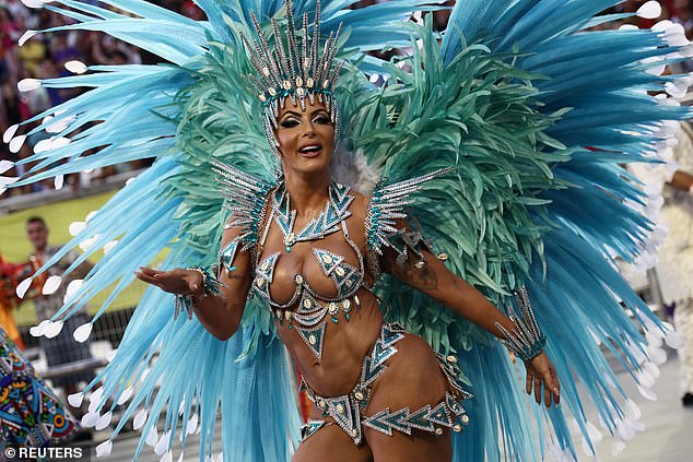 Revelers from the Academicos do Tucuruvi school perform during the second night of the carnival parade at Anhembi Sambadrome in Sao Paulo