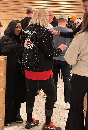 Donna wore a black jacket with the Chiefs logo on the back