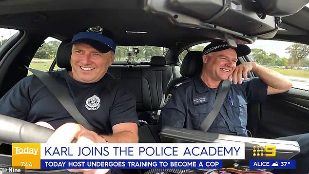 The media personality jumped into a police car to go on a 'chase' through Sydney with another police officer, and was later allowed to try getting behind the wheel