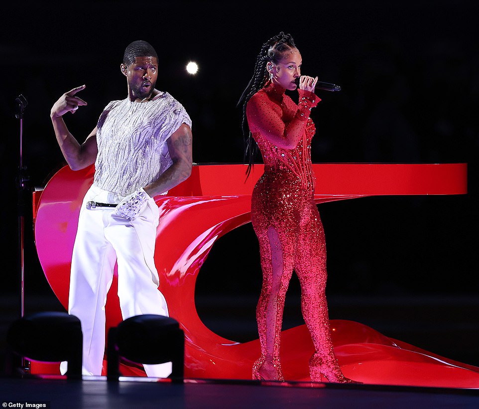 It was previously reported that Alicia Keys would be joining Usher, and she did not disappoint.  The singer appeared in a sizzling red sequined bodysuit to accompany her flowing red piano