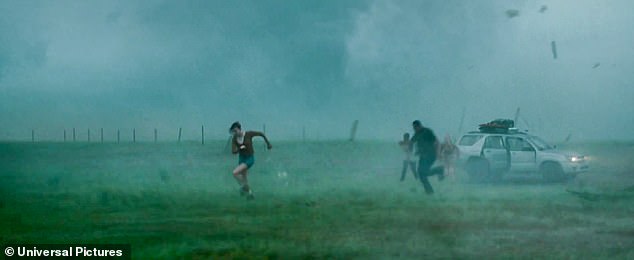 The trailer opens with a team of meteorologists driving through a rainy tornado, and the team is forced to abandon their vehicle and take shelter after their vehicle is struck by flying debris.