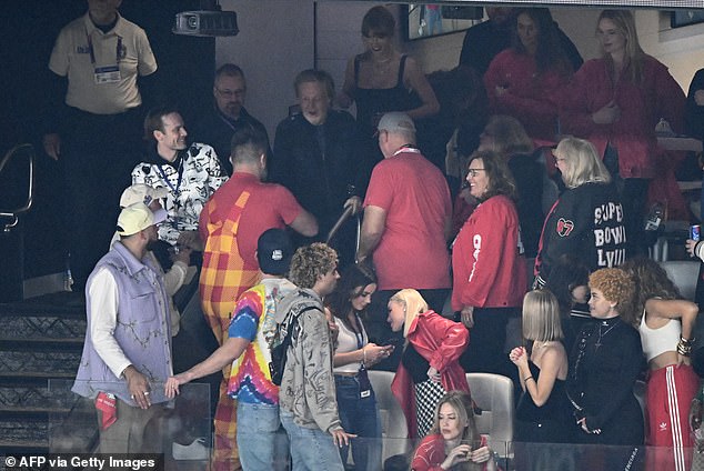 He was also seen being introduced to Travis Kelce's brother, Philadelphia Eagles center Jason Kelce (red and yellow overalls) in the suite.