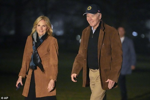 President Joe Biden and first lady Jill Biden walk across the South Lawn of the White House in Washington on Sunday, February 11, 2024, after returning from a trip to Delaware