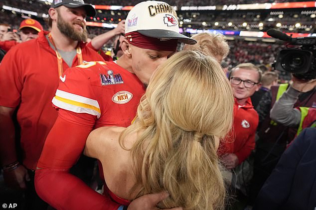 The Chiefs quarterback's wife - who channeled Britney Spears in a racy red PVC look to the game - was also joined by their two little ones: daughter Sterling, three, and son Bronze, two