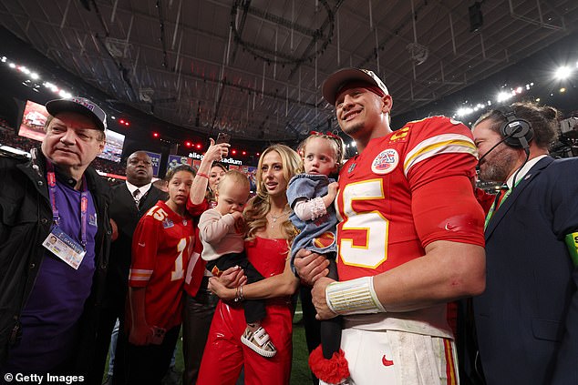 She also joined the quarterback, as well as some of his other teammates and coach, Andy Reid, as they were presented with the Lombardi Trophy on a small stage on the field.